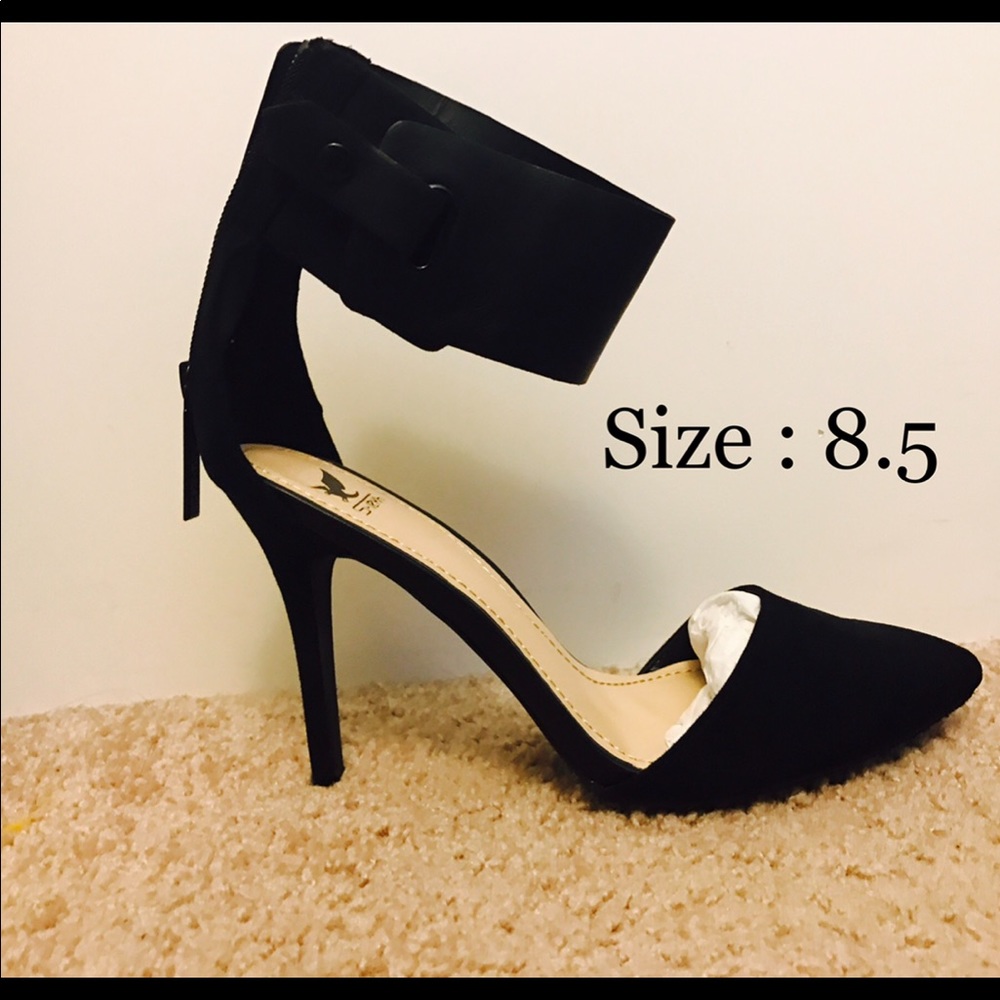 Black pointed heels with ankle strap